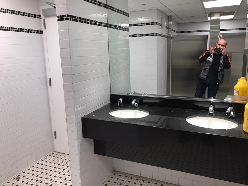Commercial restroom tile and vanity installation
