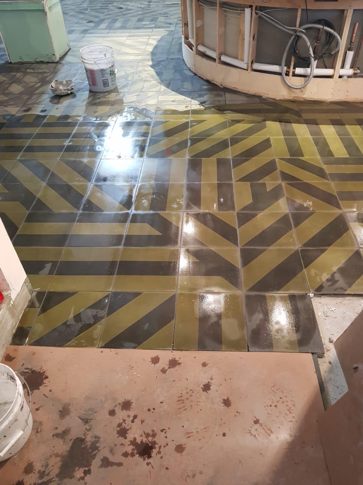 Patterned ceramic tile floor installation