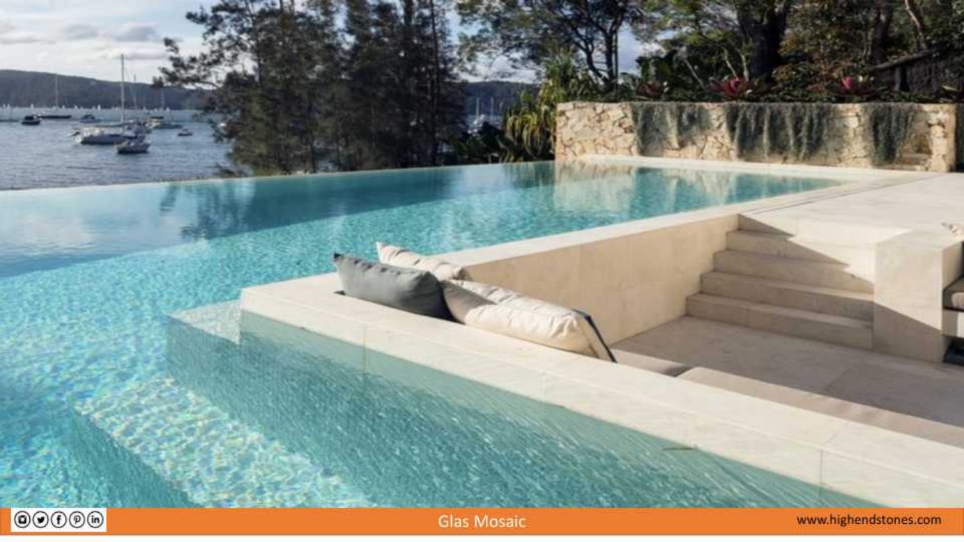 Luxury pool ledge with pale glass mosaic tile