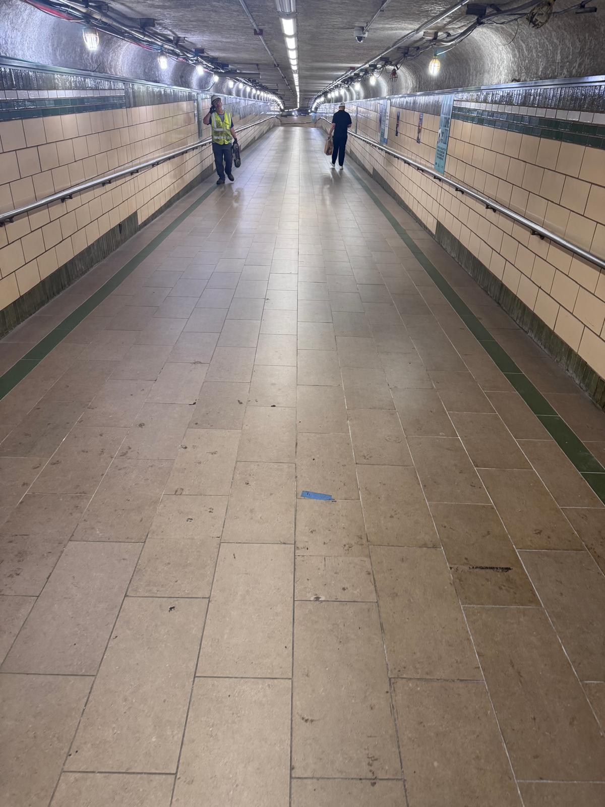Newport PATH Station long corridor floor tile and wall tile