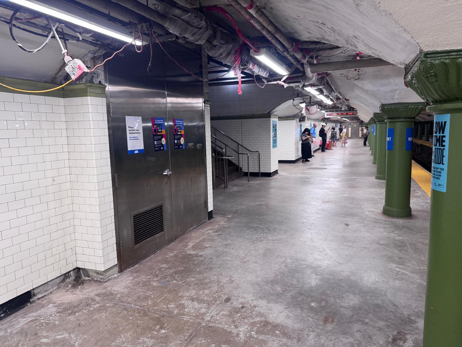 Active Newport PATH Station platform tile work