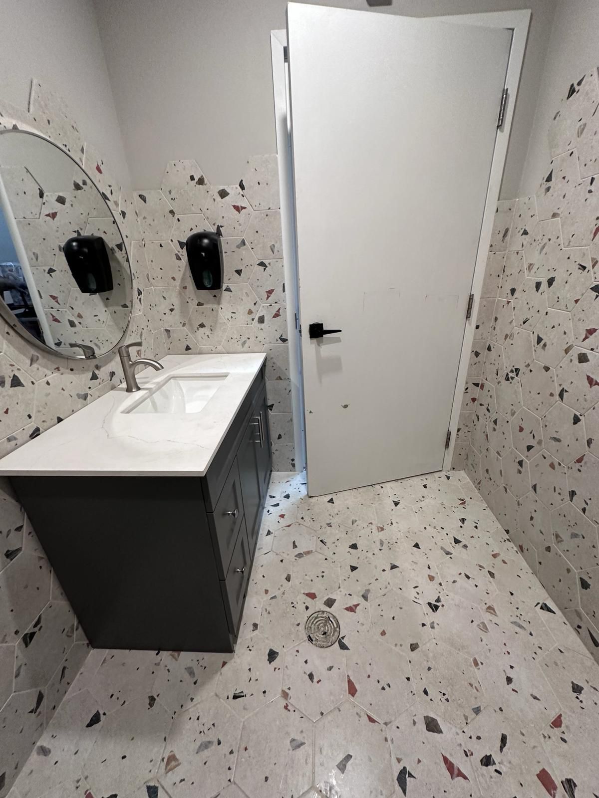 Private bathroom tile vanity and floor installation