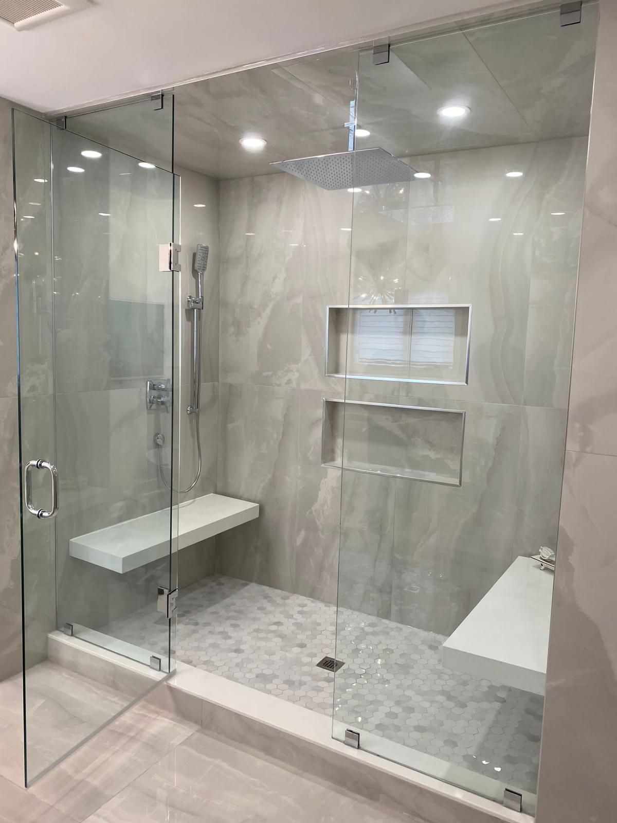 Shower tile installation with niche and bench