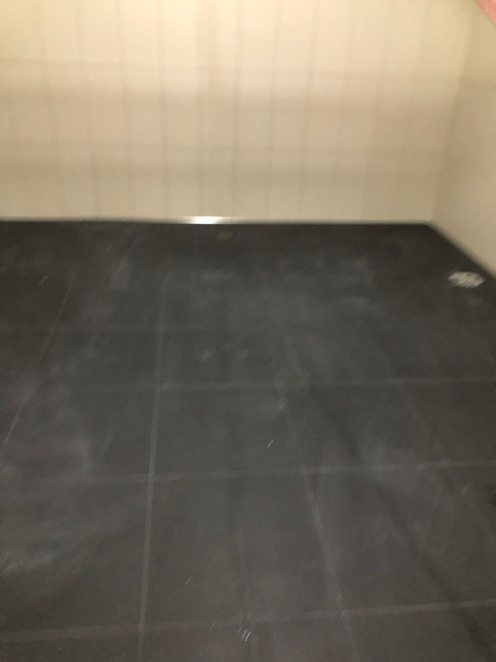 Finished dark commercial tile floor